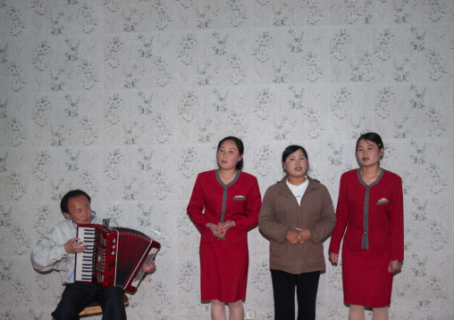 North Korean people singing inside a house, North Hamgyong Province, Jung Pyong Ri, North Korea