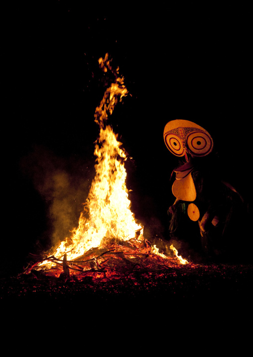 Dancer with a giant mask during a Baining tribe fire dance, East New Britain Province, Rabaul, Papua New Guinea