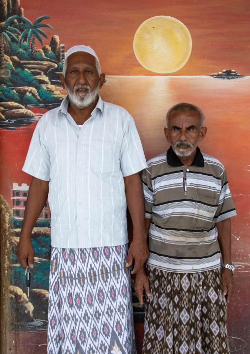 Portrait of a farasani men standing in front of a painted fresco, Red Sea, Farasan, Saudi Arabia