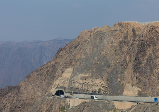 Cars entering a tunnel in the mountain, Asir province, Muhayil, Saudi Arabia