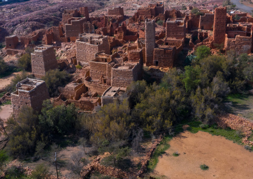 Aerial view of red stone and mud houses with slates in a village, Asir province, Sarat Abidah, Saudi Arabia