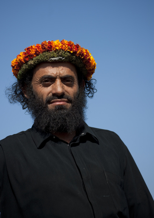 Portrait of a flower man wearing a floral crown on the head, Jizan province, Addayer, Saudi Arabia