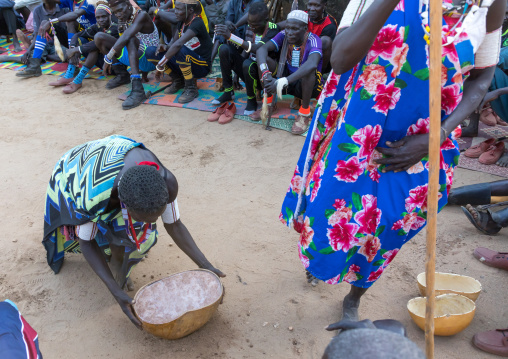 Larim tribe woman carrying alcohol in a calabash during a wedding ceremony, Boya Mountains, Imatong, South Sudan