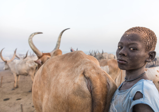 Portrait of a Mundari tribe boy covered in ash to repel flies and mosquitoes in a cattle camp, Central Equatoria, Terekeka, South Sudan