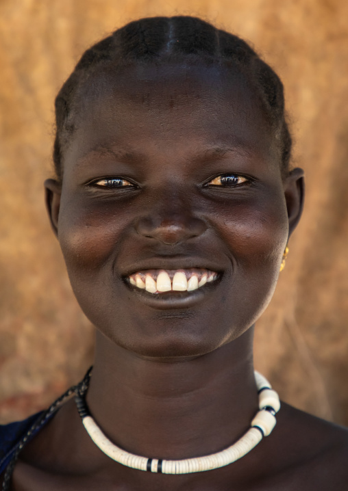 Portrait of a smiling Mundari tribe woman, Central Equatoria, Terekeka, South Sudan