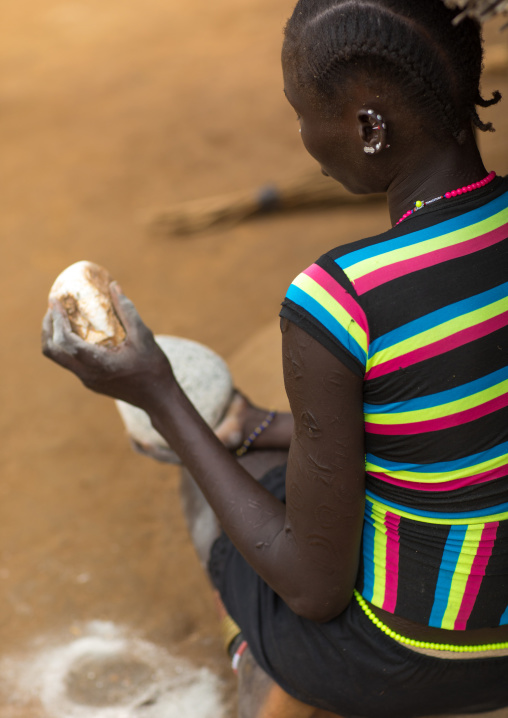 Larim tribe woman preparing food, Boya Mountains, Imatong, South Sudan