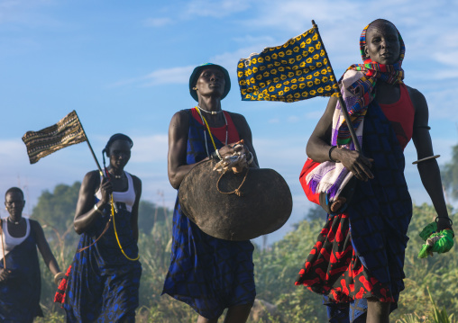 Mundari tribe women marching in line while celebrating a wedding, Central Equatoria, Terekeka, South Sudan