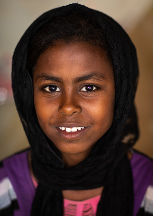 Portrait of a smiling Beja tribe girl, Red Sea State, Port Sudan, Sudan